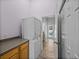 A laundry area featuring a stacked washer and dryer and a nearby closet at 38824 Raiser Rd, Dade City, FL 33525