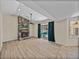 Bright living room with fireplace, ceiling fan, and sliding glass doors to pool at 38824 Raiser Rd, Dade City, FL 33525