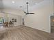 Open concept living area featuring tile floors and views of the kitchen and backyard at 38824 Raiser Rd, Dade City, FL 33525