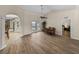 Open-concept living space with dining area offering access to the pool area and adjacent rooms at 38824 Raiser Rd, Dade City, FL 33525