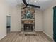 Living room featuring a stone fireplace, tile floors, and neutral paint at 38824 Raiser Rd, Dade City, FL 33525