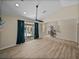 Open living room features sliding glass doors to the lanai and backyard at 38824 Raiser Rd, Dade City, FL 33525