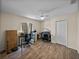 An office space with a ceiling fan, natural light, and tile flooring at 38824 Raiser Rd, Dade City, FL 33525