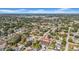 Overhead neighborhood shot shows houses with mature trees and a partly cloudy sky at 4085 37Th N Ave, St Petersburg, FL 33713