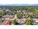 Aerial view showcases lush greenery, residential homes, and a tranquil neighborhood setting at 4085 37Th N Ave, St Petersburg, FL 33713