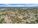 Aerial view of neighborhood homes and a wide city street on a partly cloudy day at 4085 37Th N Ave, St Petersburg, FL 33713