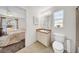 Bathroom with a single sink vanity, toilet, and connection to a bedroom at 4085 37Th N Ave, St Petersburg, FL 33713