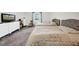 Bedroom featuring two beds with gray headboards, a dresser, and soft, neutral tones at 4085 37Th N Ave, St Petersburg, FL 33713