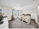 Bedroom featuring two beds, natural light, a ceiling fan and grey carpet at 4085 37Th N Ave, St Petersburg, FL 33713