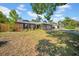 Charming single-story brick home featuring an attached two-car garage and well-maintained front lawn at 4085 37Th N Ave, St Petersburg, FL 33713