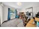 Bright home office featuring a large window, neutral paint, gray carpet, and ample workspace for productivity at 4085 37Th N Ave, St Petersburg, FL 33713