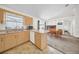 Kitchen open to the dining area, featuring light wood cabinets and modern appliances at 4085 37Th N Ave, St Petersburg, FL 33713