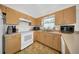 Bright kitchen features light cabinets and white appliances, offering a clean and functional space at 4085 37Th N Ave, St Petersburg, FL 33713