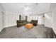 Bright and airy living room with plush carpeting, comfortable seating, and white walls at 4085 37Th N Ave, St Petersburg, FL 33713