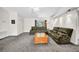 Bright and airy living room with plush carpeting, comfortable seating, and white walls at 4085 37Th N Ave, St Petersburg, FL 33713