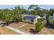 Aerial shot of a charming yellow house with solar panels and a lovely screened porch at 4517 2Nd S Ave, St Petersburg, FL 33711