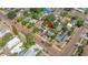 Neighborhood aerial view, highlighting the charming yellow house and solar panels at 4517 2Nd S Ave, St Petersburg, FL 33711