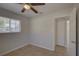 Bright bedroom features a window with blinds and access to a closet for convenient storage solutions at 4517 2Nd S Ave, St Petersburg, FL 33711