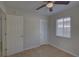 Comfortable bedroom with tiled floor, two doors and a sun-lit window at 4517 2Nd S Ave, St Petersburg, FL 33711