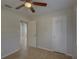 Comfortable bedroom with tiled floor, two doors and a sun-lit window at 4517 2Nd S Ave, St Petersburg, FL 33711