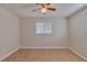 Empty bedroom with tiled floor, ceiling fan and a sun-lit window at 4517 2Nd S Ave, St Petersburg, FL 33711