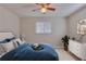 Staged bedroom featuring a tiled floor, ceiling fan and neutral color palette at 4517 2Nd S Ave, St Petersburg, FL 33711