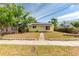 Charming yellow home featuring solar panels and a well-maintained front yard at 4517 2Nd S Ave, St Petersburg, FL 33711