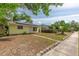 Charming home with solar panels and a neatly landscaped front yard at 4517 2Nd S Ave, St Petersburg, FL 33711