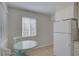Bright eat-in kitchen featuring white cabinets, granite countertops, and a breakfast nook at 4517 2Nd S Ave, St Petersburg, FL 33711