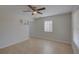 Bright living room featuring neutral walls, tile flooring, built-in shelves, and a sunlit window at 4517 2Nd S Ave, St Petersburg, FL 33711