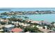 An aerial view of a waterfront community with large homes, lush landscaping, and a bay in the background at 4900 Brittany S Dr # 1810, St Petersburg, FL 33715