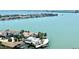 Serene aerial view of waterfront homes with pools and docks, set against the backdrop of the calm intercoastal waters at 4900 Brittany S Dr # 1810, St Petersburg, FL 33715