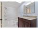 Bright bathroom with updated vanity, granite counters, and a shower-tub combination at 4900 Brittany S Dr # 1810, St Petersburg, FL 33715
