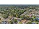 Beautiful neighborhood aerial showcasing tree-lined streets and proximity to community lake at 4914 Country Hills Dr, Tampa, FL 33624