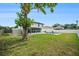 Beautiful backyard oasis with a private pool, a covered patio, and a lush green lawn, great for relaxation at 4914 Country Hills Dr, Tampa, FL 33624