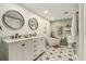 Stylish bathroom with double vanity, soaking tub, and elegant tile flooring at 4914 Country Hills Dr, Tampa, FL 33624