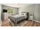 Cozy bedroom with a plush bed, soft rug, window view, and stylish furnishings at 4914 Country Hills Dr, Tampa, FL 33624