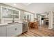 Bright kitchen with stainless steel appliances, white cabinets, and breakfast nook at 4914 Country Hills Dr, Tampa, FL 33624