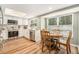 Modern kitchen with stainless steel appliances, wood table, and bright lighting at 4914 Country Hills Dr, Tampa, FL 33624