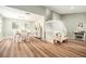 Open-concept living area showcasing wood floors, staircase, and dining space at 4914 Country Hills Dr, Tampa, FL 33624