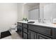Bathroom featuring white countertop with dark cabinets and simple decor at 5048 Inshore Landing Dr, Apollo Beach, FL 33572
