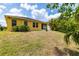 Charming exterior of the home with a well-maintained lawn and mature landscaping at 5048 Inshore Landing Dr, Apollo Beach, FL 33572