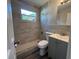 Renovated bathroom featuring stylish tile, walk-in shower, and modern vanity at 5660 86Th Ave, Pinellas Park, FL 33782