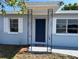 Inviting home entrance featuring an ornate metal porch and welcome mat at 5660 86Th Ave, Pinellas Park, FL 33782