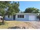 Charming one-story home with a well-maintained lawn and attached garage offering comfort at 5660 86Th Ave, Pinellas Park, FL 33782
