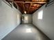 Large garage featuring freshly painted floors and walls, as well as a new garage door at 5660 86Th Ave, Pinellas Park, FL 33782