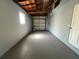 Spacious garage features concrete flooring, painted walls and a garage door at 5660 86Th Ave, Pinellas Park, FL 33782