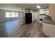 Bright kitchen adjacent to the living space, featuring modern appliances and flooring at 5660 86Th Ave, Pinellas Park, FL 33782