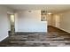 Bright living room with new flooring and an airy atmosphere, leading to other rooms at 5660 86Th N Ave, Pinellas Park, FL 33782