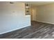 Spacious living room featuring modern gray wood floors and neutral wall colors at 5660 86Th N Ave, Pinellas Park, FL 33782